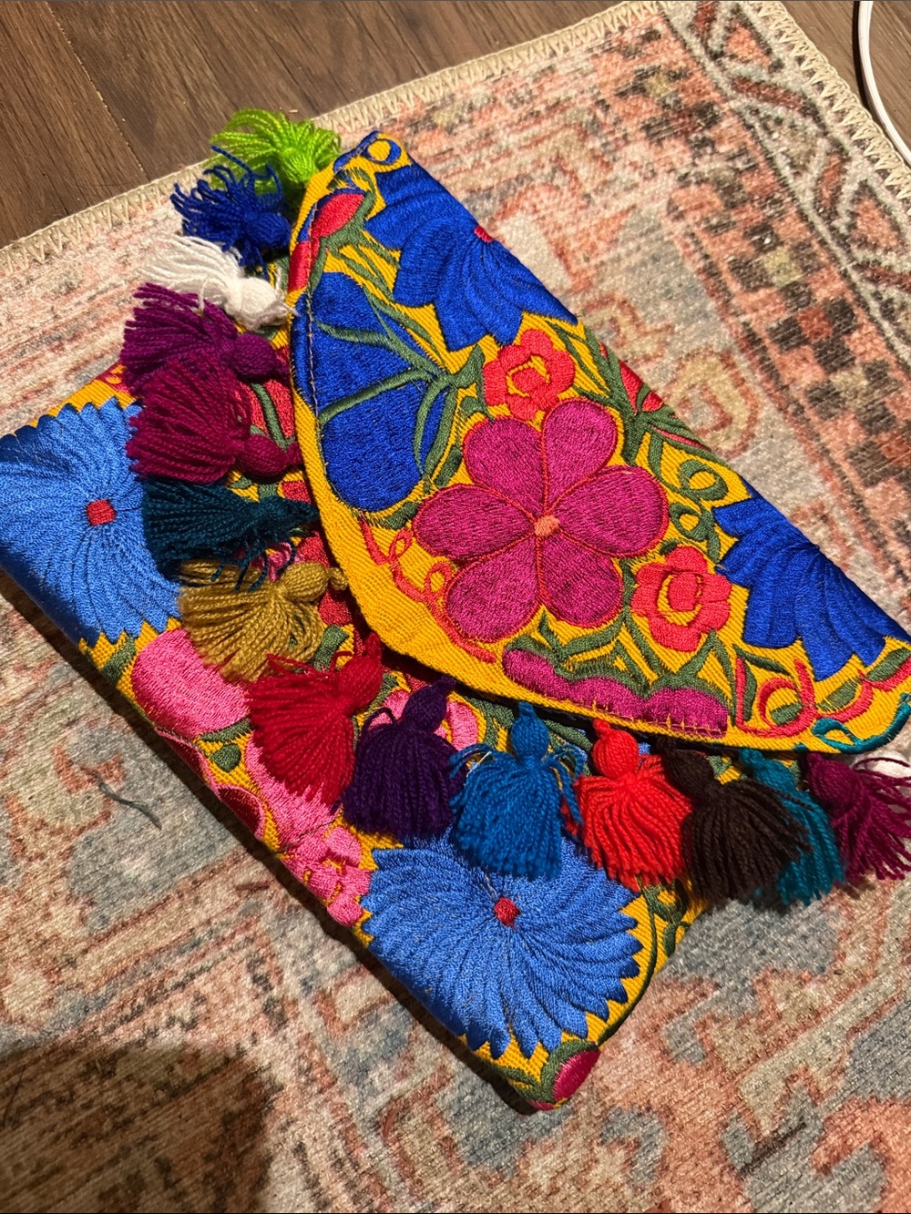 Embroidered colorful clutch with tassels